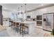 Modern kitchen featuring stainless steel appliances, an island with seating, and white cabinets at 689 Rogue Wave St, Las Vegas, NV 89138
