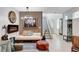 Stylish living room with decorative fireplace, modern lighting, and staircase at 689 Rogue Wave St, Las Vegas, NV 89138