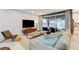 Relaxing living room with a large sofa, sliding glass doors, and a modern fireplace at 689 Rogue Wave St, Las Vegas, NV 89138