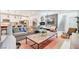 Spacious living area featuring an open layout, stylish furniture, and modern decor at 689 Rogue Wave St, Las Vegas, NV 89138
