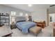 Bright main bedroom with a comfortable seating, ample natural light, and modern decor at 689 Rogue Wave St, Las Vegas, NV 89138