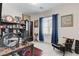 Office space bathed in natural light with a desk, chair, and bookshelf filled with decor at 689 Rogue Wave St, Las Vegas, NV 89138