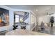 Open concept floor plan with kitchen counter to dining area, featuring modern decor and stylish finishes at 7329 Restful Springs Ct, Las Vegas, NV 89128