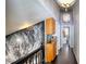 Unique second story hallway with hardwood floors, a ceiling light fixture and a decorative wall mural at 7329 Restful Springs Ct, Las Vegas, NV 89128