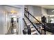 View of the staircase and hallway leading to the living room with hardwood flooring at 7329 Restful Springs Ct, Las Vegas, NV 89128