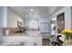 Bright, modern kitchen with stainless steel appliances and white cabinets and breakfast bar at 7329 Restful Springs Ct, Las Vegas, NV 89128