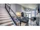Spacious living room featuring high ceilings, hardwood floors, modern lighting, and stylish decor at 7329 Restful Springs Ct, Las Vegas, NV 89128