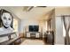 Stylish living room with dark wood floors, television, modern furniture, and contemporary decor at 7329 Restful Springs Ct, Las Vegas, NV 89128