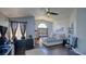 Spacious main bedroom with hard wood flooring, large windows, and a comfortable king size bed at 7329 Restful Springs Ct, Las Vegas, NV 89128