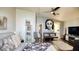 Bright main bedroom features hard wood floors and contemporary wall art at 7329 Restful Springs Ct, Las Vegas, NV 89128