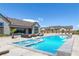 Luxurious backyard with a pristine pool, outdoor lounge area, and elegant landscaping at 8838 Sorrel Hills Ct, Las Vegas, NV 89113