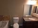 Bathroom featuring a granite countertop vanity, toilet, and a tub with marble backsplash at 9000 Las Vegas Blvd # 2101, Las Vegas, NV 89123