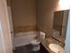 Bathroom featuring a granite countertop vanity and a tub with marble backsplash at 9000 Las Vegas Blvd # 2101, Las Vegas, NV 89123