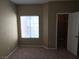 This bedroom features neutral walls, carpet, and a window with blinds at 9000 Las Vegas Blvd # 2101, Las Vegas, NV 89123