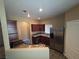 Well-lit kitchen with stainless steel appliances, granite countertops, and dark wood cabinets at 9000 Las Vegas Blvd # 2101, Las Vegas, NV 89123