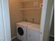 Convenient laundry room with washer, dryer, and storage shelves at 9000 Las Vegas Blvd # 2101, Las Vegas, NV 89123