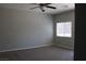 Comfortable bedroom with carpet, ceiling fan, and a window that provides natural light at 9065 Mastodon Ave, Las Vegas, NV 89149