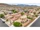 A high angle view showing a neighborhood and mountains in the background at 9626 Grapeland Ave, Las Vegas, NV 89148