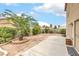 A view of the backyard patio from the lawn area at 9626 Grapeland Ave, Las Vegas, NV 89148