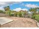A blank canvas backyard with small shrubs and a block wall at 9626 Grapeland Ave, Las Vegas, NV 89148