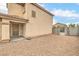 Backyard features desert landscaping, block wall, and pedestrian gate at 9626 Grapeland Ave, Las Vegas, NV 89148