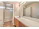 Well-lit bathroom features a vanity with wood cabinets and a shower-tub combo at 9626 Grapeland Ave, Las Vegas, NV 89148