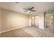 Spacious carpeted bedroom with ceiling fan and frosted closet at 9626 Grapeland Ave, Las Vegas, NV 89148