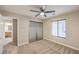 An airy bedroom with sliding closet doors and a view into the bathroom at 9626 Grapeland Ave, Las Vegas, NV 89148
