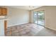 A dining area is illuminated with modern lighting and boasts access to a patio at 9626 Grapeland Ave, Las Vegas, NV 89148