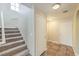 Inviting entryway with staircase and tile flooring, creating a warm and welcoming ambiance at 9626 Grapeland Ave, Las Vegas, NV 89148