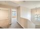 Upstairs hallway filled with natural light and neutral color palette at 9626 Grapeland Ave, Las Vegas, NV 89148