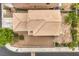 Aerial view of a house with brown roof and foliage and a gravel front yard at 9626 Grapeland Ave, Las Vegas, NV 89148