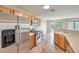 A kitchen with stainless steel appliances and light wood cabinets at 9626 Grapeland Ave, Las Vegas, NV 89148