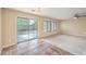 A spacious living room features carpet, tile, and a sliding door for outdoor access at 9626 Grapeland Ave, Las Vegas, NV 89148
