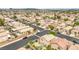 Overhead view of a community, with various tan stucco homes and paved streets at 9626 Grapeland Ave, Las Vegas, NV 89148