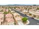 Aerial view of a densely populated suburban neighborhood featuring tan stucco homes with tile roofs at 9626 Grapeland Ave, Las Vegas, NV 89148