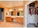 Light and bright bathroom boasting tile flooring, double vanity, and a walk-in closet at 98 Milicity Rd, Henderson, NV 89012