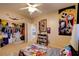 Bedroom with playful decor, closet, carpet, and a ceiling fan creating a fun space at 98 Milicity Rd, Henderson, NV 89012