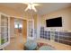 room with french doors, a ceiling fan, and carpeted flooring, creating a cozy space at 98 Milicity Rd, Henderson, NV 89012
