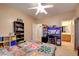 Neutral bedroom with a Minecraft themed comforter features a workspace and entry to ensuite bath at 98 Milicity Rd, Henderson, NV 89012
