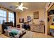 Bedroom with playful decor, large windows, carpeted flooring, and closet at 98 Milicity Rd, Henderson, NV 89012