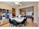 The formal dining room features hardwood floors, storage shelves, and flows to the kitchen and living room at 98 Milicity Rd, Henderson, NV 89012