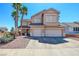 Inviting two-story home with three-car garage, manicured landscaping, and desert-friendly rock groundcover at 98 Milicity Rd, Henderson, NV 89012