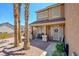 Inviting front porch with bench seating, decorative plants, and a welcoming entrance at 98 Milicity Rd, Henderson, NV 89012