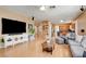 The spacious living room features hardwood floors, neutral walls, and opens to the kitchen at 98 Milicity Rd, Henderson, NV 89012