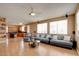 The spacious living room features hardwood floors, neutral walls, and a ceiling fan at 98 Milicity Rd, Henderson, NV 89012