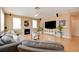The spacious living room features hardwood floors, a fireplace, and neutral colored walls at 98 Milicity Rd, Henderson, NV 89012