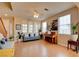 Comfortable living room with hardwood floors, a piano, and plenty of natural light at 98 Milicity Rd, Henderson, NV 89012