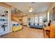 Open living room features hardwood floors, natural light and seamless flow to the staircase at 98 Milicity Rd, Henderson, NV 89012