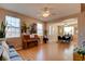 Spacious living room with hardwood floors, large windows, and ample natural light at 98 Milicity Rd, Henderson, NV 89012
